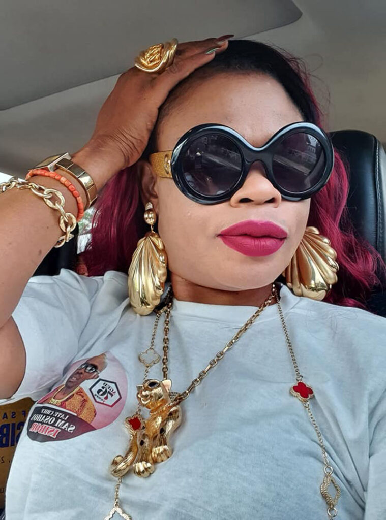 Christy Gold, Nigerian Human Trafficker in Dubai, UAE showing off her gold